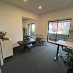 Bright and modern physiotherapy treatment room with rehab equipment, ready for patient care in Leichhardt clinic.